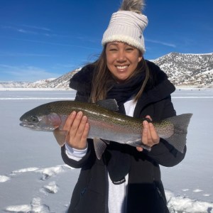 a person holding a fish in the water
