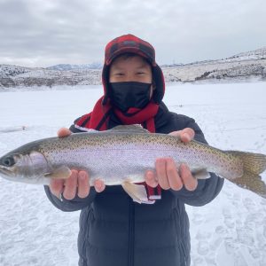 a person holding a fish in the water