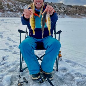 a man and a woman taking a selfie in the snow