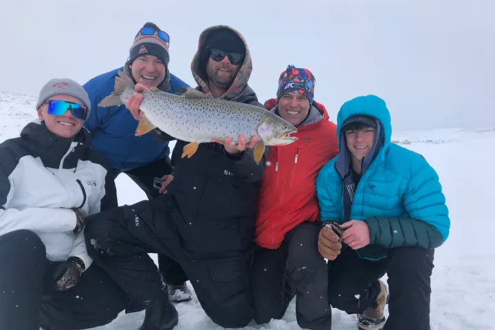 a group of people that are standing in the snow