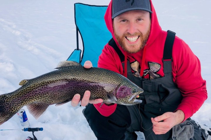 a man holding a fish