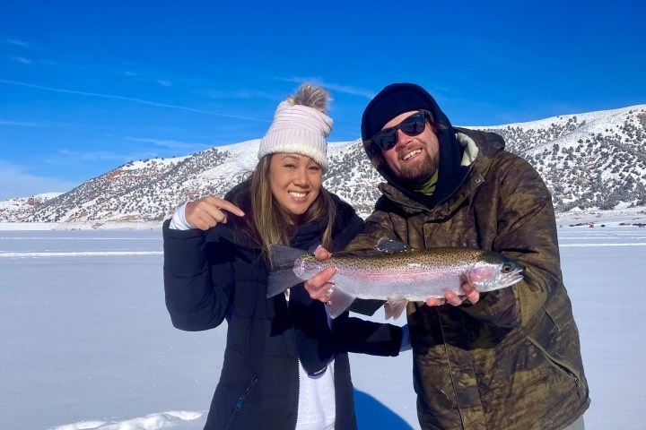 a person holding a fish