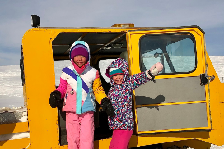 a person standing on a snow board