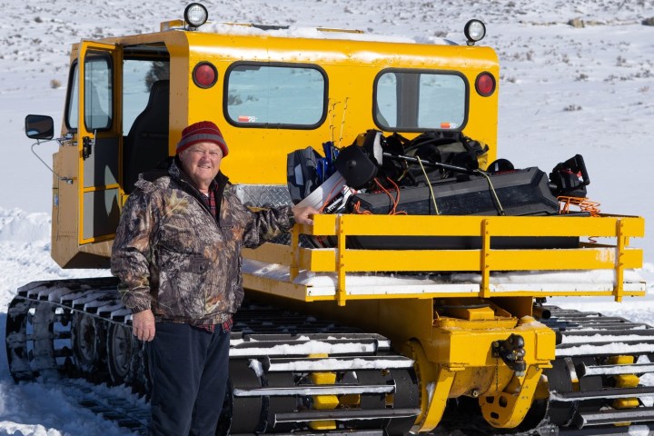 a man riding on the back of a truck